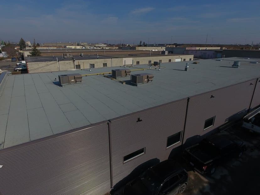 Industrial Roof Replacement and Corrugated Siding Installation